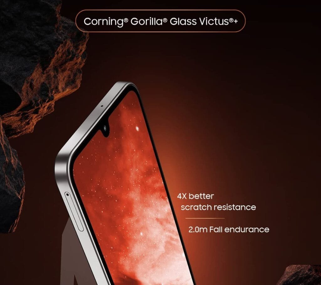 A Samsung Galaxy M36 5G phone is shown partially, highlighting its screen protected by Corning Gorilla Glass Victus+. Text emphasizes 4x better scratch resistance and 2.0m fall endurance.
