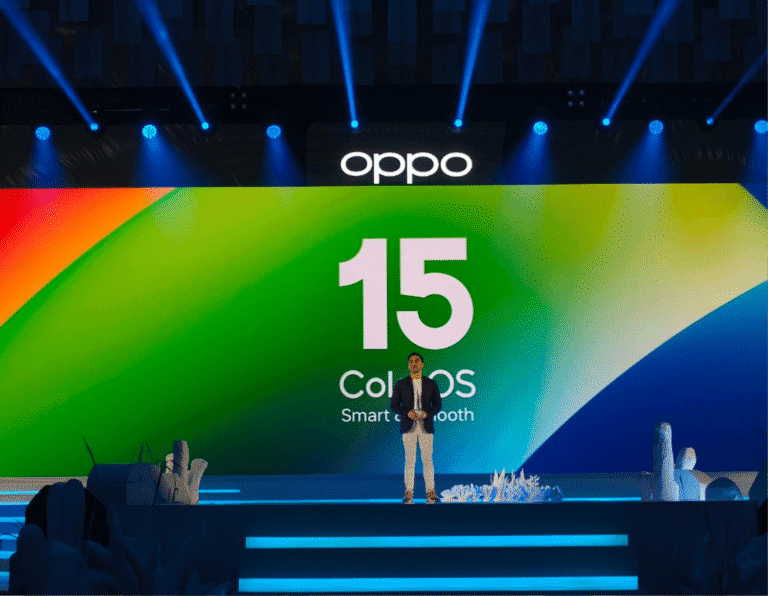 ColorOS 15 Update: AI-Powered Tools Challenge Paid ChatGPT A person standing on stage at a product launch event for OPPO's ColorOS 15 operating system. The large screen behind them displays the ColorOS 15 logo.