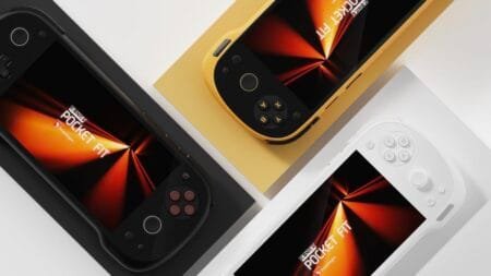 Close-up of three Konkr Pocket Fit handheld gaming consoles in Phantom Black, Dragon Yellow, and Snow White, arranged diagonally on a white surface.