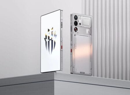 Close-up of two Redmagic 11 Pro smartphones, one with a white screen displaying the Redmagic logo, the other showing the transparent, tech-inspired back design with visible components and branding.