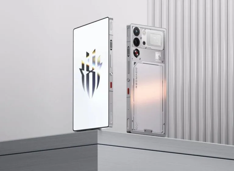 Redmagic 11 Pro Spotted on Geekbench with Snapdragon 8 Gen 5? Close-up of two Redmagic 11 Pro smartphones, one with a white screen displaying the Redmagic logo, the other showing the transparent, tech-inspired back design with visible components and branding.