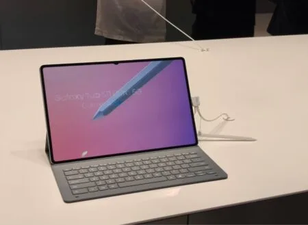 Samsung Galaxy Tab S11 Ultra and Galaxy Tab S11 Launched Globally A Samsung Galaxy Tab S11 Ultra with a keyboard attachment is displayed on a white table. The screen shows a stylus hovering over the display.