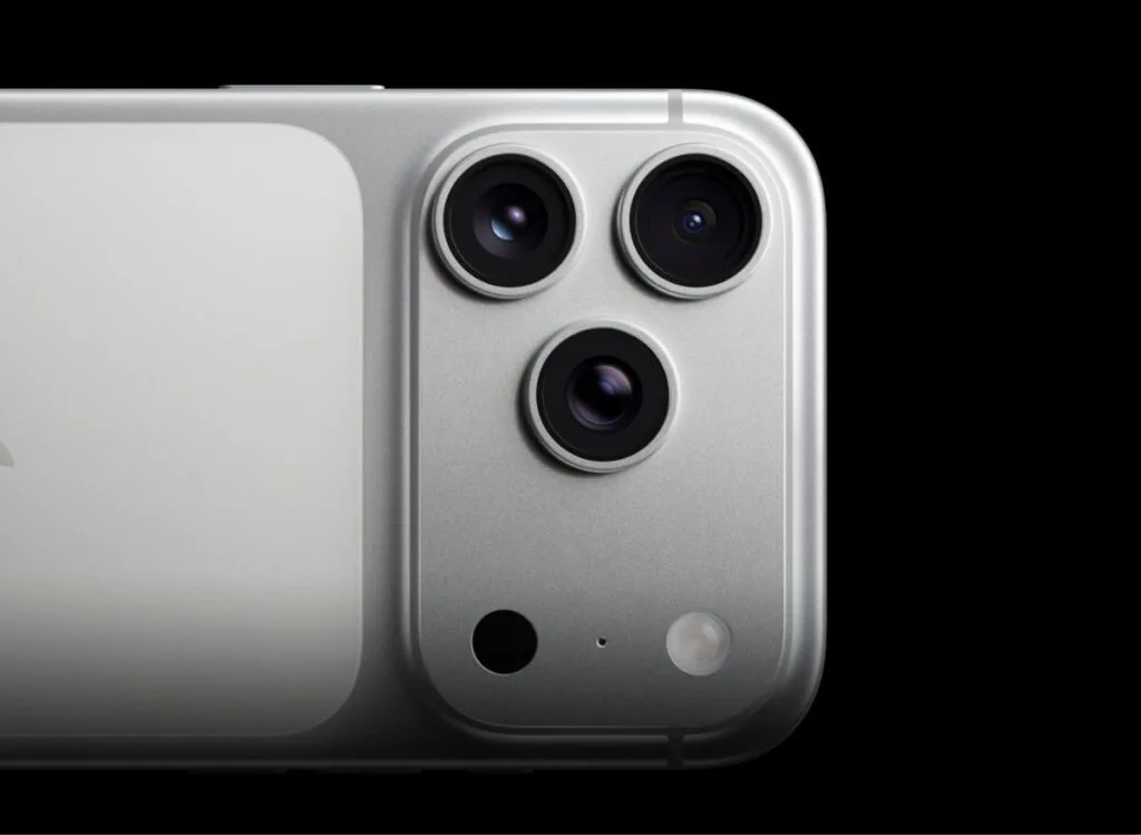 iPhone 17 Pro Max Camera | Triple 48MP Cameras and Professional Video Upgrades 1 Close-up of the iPhone 17 Pro Max's silver finish with its triple-lens camera system, microphone, and flash, set against a stark black background.