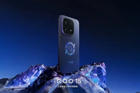 iQOO 15 Honor of Kings 10th Anniversary Collector’s Edition iQOO 15 Honor of Kings Collector's Edition: Phone with blue gradient back, geometric design, quad-camera array, and Honor of Kings logo, displayed on a crystalline surface against a blue background.