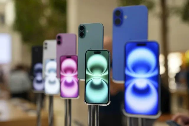 Assortment of iPhone models; memory chip shortages forecast to increase smartphone prices in 2026.