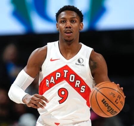 RJ Barrett, Toronto Raptors player currently sidelined with a knee injury, in a game photo.