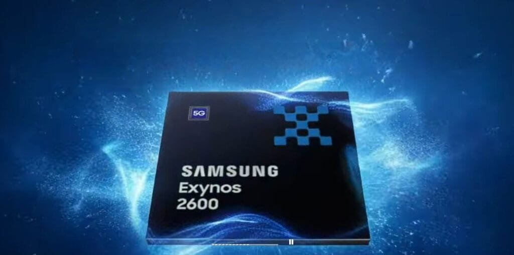Close-up of the Samsung Exynos 2600 processor, featuring the Samsung logo, Exynos 2600 name, and a blue geometric design on a sleek, dark square chip. The backdrop is a dynamic blue gradient with swirling energy effects.