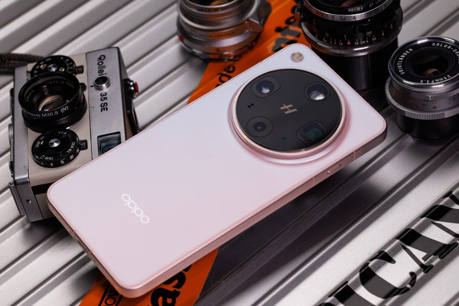 Image highlighting the Oppo Find X9 Ultra's unique quad-camera design, positioned among classic camera equipment.