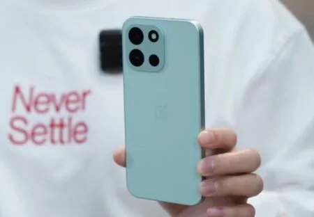 Leaked image of the OnePlus Turbo 6 in a light blue color, showing the rear camera setup and OnePlus logo.