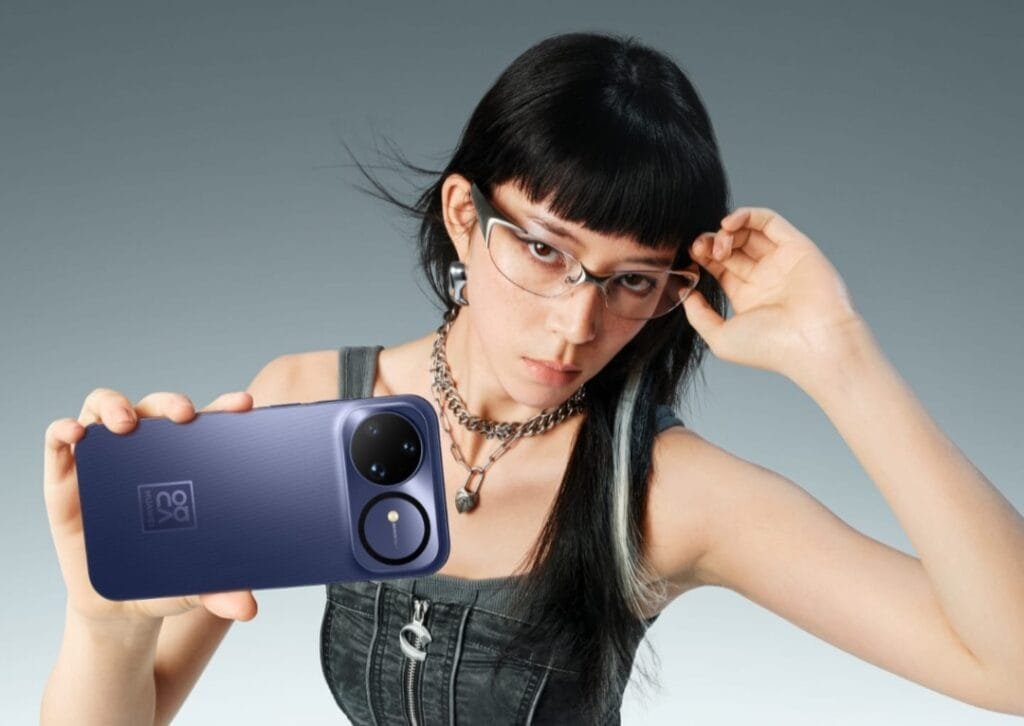 A person with glasses holds up a Huawei Nova 15 Ultra, showcasing its camera design.