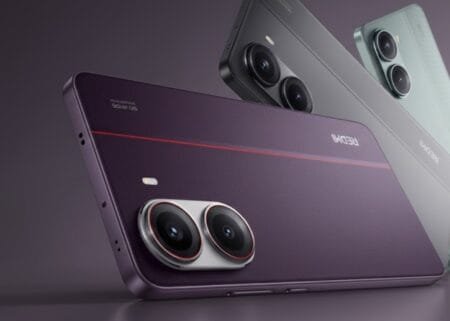 Redmi Turbo 5 Pro 3C Certified, Appears with 100W Charger Product render of the Redmi Turbo 5 Pro smartphone, showcasing three color variants. In the foreground is a deep purple model with a textured back, a thin red accent line, and a dual-camera module with silver rings and red trim. Behind it are a matte gray variant and a light teal variant, both featuring the same dual-camera design. The 'REDMI' logo and '5G' text are visible on the purple model’s back.