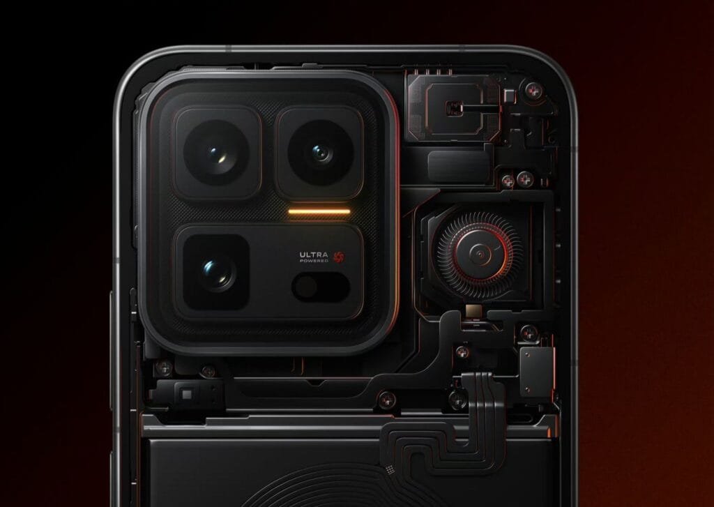Rear view of the iQOO 15 Ultra in a cutaway design, showcasing internal components against a dark background. Features a square camera module with three lenses and 'ULTRA POWERED' labeling, plus visible elements like a fan with red accents, circuit pathways, and screws, highlighting its internal engineering.