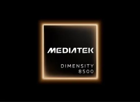 MediaTek Unveils Dimensity 8500, Delivering Up to 2.4 Million Antutu Score A promotional image of the MediaTek Dimensity 8500 mobile processor, displayed against a solid black background. The chip is presented as a square with a subtle gradient surface, framed by a glowing warm orange border that emits a soft halo effect. The word "MEDIATEK" appears in large, bold, silver capital letters at the top of the chip’s face; below it, "DIMENSITY" is printed in smaller silver capital letters, with "8500" directly underneath in matching styling (note: "DIMENSITY" is misspelled as "DENSITY" in the image).