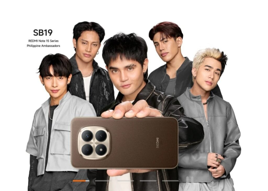 Filipino boy group SB19, named as Philippine Ambassadors for the Redmi Note 15 Series, pose together against a white background. One member holds up a brown Redmi Note 15 smartphone, displaying its quad-camera module with a metallic frame. Text in the top-left corner reads: 'SB19 – REDMI Note 15 Series Philippine Ambassadors'.