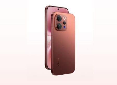 Vivo V70 "Morning Glow": gradient pink-copper finish, rear 3-lens ZEISS camera module, front punch-hole 1.5K OLED display, aluminum frame.
