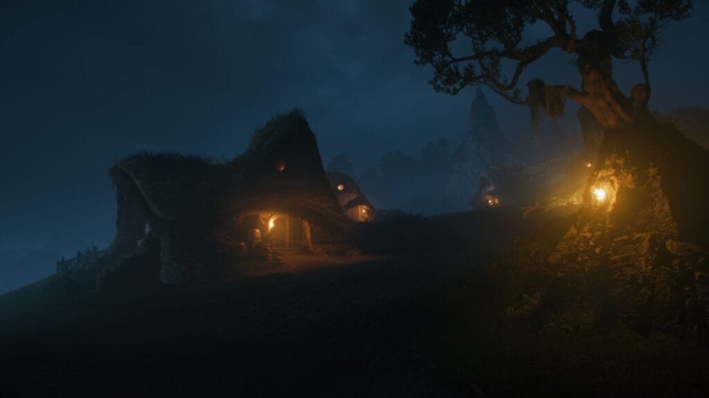 A moody nighttime scene from a fantasy fable game—mist shrouds rolling hills dotted with moss-covered, earthy huts that glow with warm candlelight. A gnarled tree looms beside a bright fire, while shadowy peaks rise in the dark distance, evoking tales of magic and secrets hidden in the night.