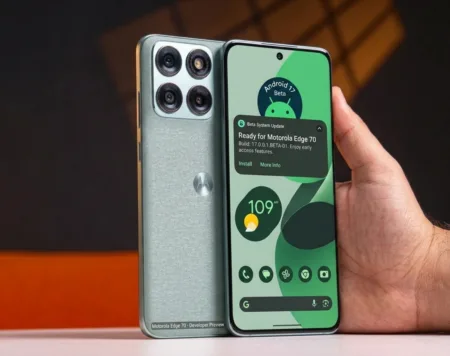 Motorola Starts Rolling Out Android 17 Beta Program in India; Edge and G Series Included A close-up photograph of the textured teal-green back of a Motorola smartphone, featuring a square camera module with four circular lenses and the silver Motorola 'M' logo.