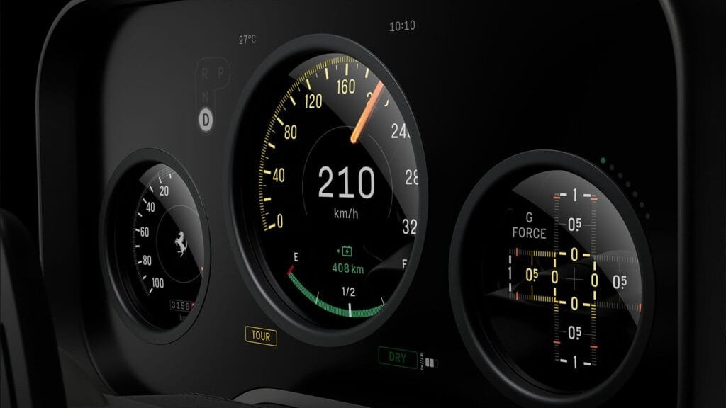 Close-up of Ferrari Luce’s digital instrument cluster: Three circular displays include a main speedometer (210 km/h, 408 km remaining range), a left gauge for auxiliary data, and a right G-force meter. Labels for 'TOUR' mode and 'DRY' driving condition are visible, with sleek black and yellow-accented graphics.