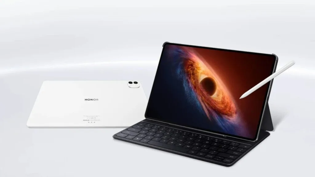 Honor MagicPad 4 tablet in white with dual rear cameras, shown with a detachable keyboard and stylus, displaying a space-themed wallpaper on its large screen.