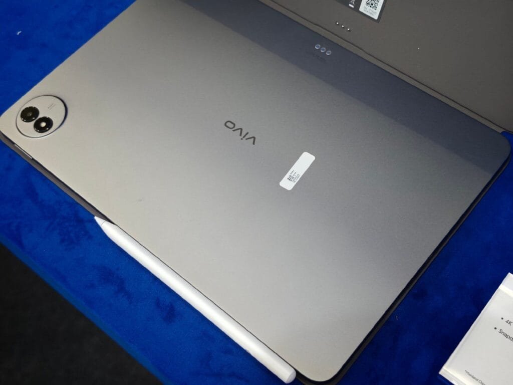 - A close-up of the Vivo Pad 6 Pro, highlighting its sleek design, stylus, and prominent rear camera module.