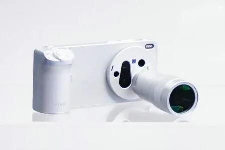White Vivo X300 Ultra smartphone paired with a dedicated camera grip and external telephoto lens attachment, showcasing a camera-like form factor against a plain white background.