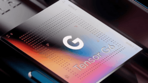 A close-up photograph of a Google Tensor G6 processor chip with a striking red, orange, blue, and purple gradient and iconic 'G' logo.