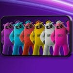 A smartphone displays colorful cartoonish humanoid characters from Fortnite Mobile—in purple, blue, red, yellow, white, and pink, all wearing sunglasses and standing side by side. The phone is set against a vibrant purple background with flowing pink and white light streaks.