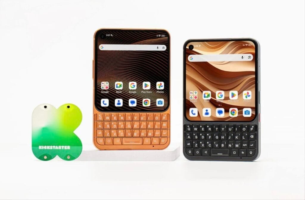 Unihertz Titan 2 Elite to Launch With Dimensity 7400 and Dimensity 8400 Chipset Options 1 Unihertz Titan 2 Elite smartphone shown in orange and black colors featuring a square display and a physical QWERTY keyboard, displayed beside a Kickstarter logo stand.