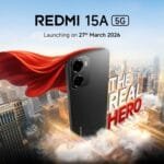 Redmi 15A 5G Teased Ahead of March 27 Launch in India 1 Promotional poster for Redmi 15A 5G. Black smartphone with red superhero cape above a cityscape. Text shows 'Redmi 15A 5G', launch date 27th March 2026, and tagline 'THE REAL HERO'.