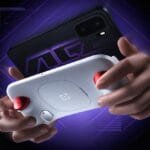 Hands holding the OnePlus Ace 6 Ultra gaming smartphone paired with a white OnePlus gaming controller featuring red accents, set against a dark purple neon-lit background