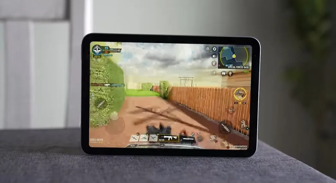 Best Compact Gaming Tablet in the Philippines (2026) 2 Apple iPad mini (7th generation) displaying a Call of Duty mobile game interface on its screen, showing gameplay graphics, controls, and in-game UI elements. The tablet is placed on a surface with a blurred indoor background.