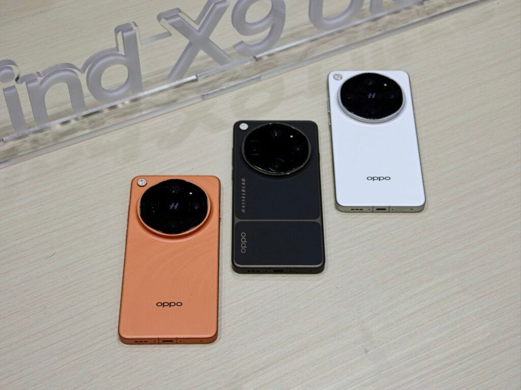 Oppo Find X9 Ultra smartphones displayed in three color variants: Orange, Black and White