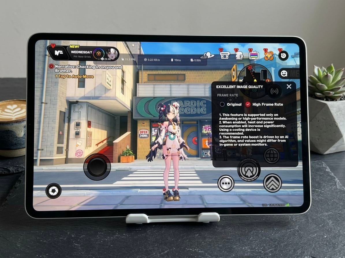 Gaming tablet displaying high frame rate gameplay with on-screen controls and graphics settings menu