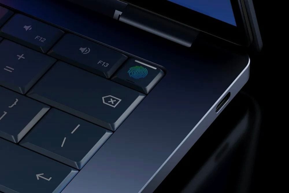 Google unveils “Googlebook” laptops built around Gemini Intelligence 2 Close-up of Googlebook keyboard area showing F12, F13 keys, a fingerprint sensor integrated into a function key, and a USB‑C port on the chassis edge.