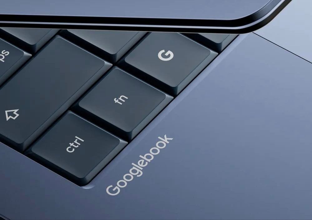 Google unveils “Googlebook” laptops built around Gemini Intelligence 1 Extreme close-up of Googlebook keyboard highlighting dedicated Google “G” key, fn, and ctrl keys; “Googlebook” logo etched onto the palm rest in light silver lettering.