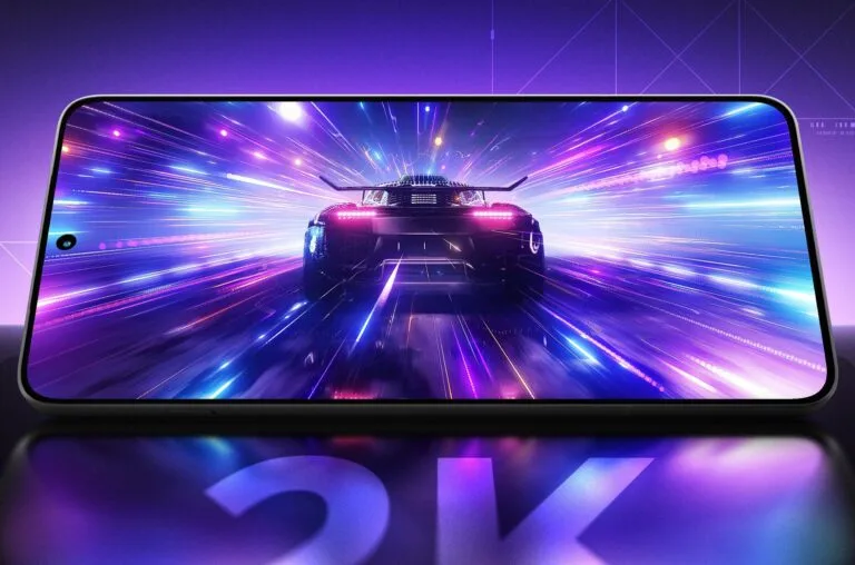 Lenovo Legion Y70 (2026) Launch Confirmed for May 19 With AI Gaming Focus and Advanced Cooling Lenovo Legion Y70 2026 displaying a high-speed racing game with vibrant purple and blue light trails, emphasizing its immersive gaming experience, with "2K" subtly reflected at the bottom