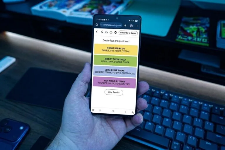 Screenshot of the NYT Connections grouping game on a smartphone, showing four color-coded categories: "THINGS BABIES DO", "MODIFY DECEPTIVELY", "JUDY BLUME BOOKS", and "FISH MINUS A LETTER". Each category lists four related words, with game interface elements and controls visible around the puzzle.