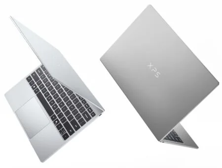 Dell XPS 13 (2026 Model) Announced; Starting Price at $699 Two views of the Dell XPS 13 (2026) laptop: open showing the keyboard and display, and closed highlighting the sleek silver CNC aluminum chassis with the XPS logo, against a plain white background