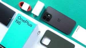 OnePlus N6 in Midnight Green shown with retail packaging, 45W fast charger, red USB‑C cable, silicone case, and documentation