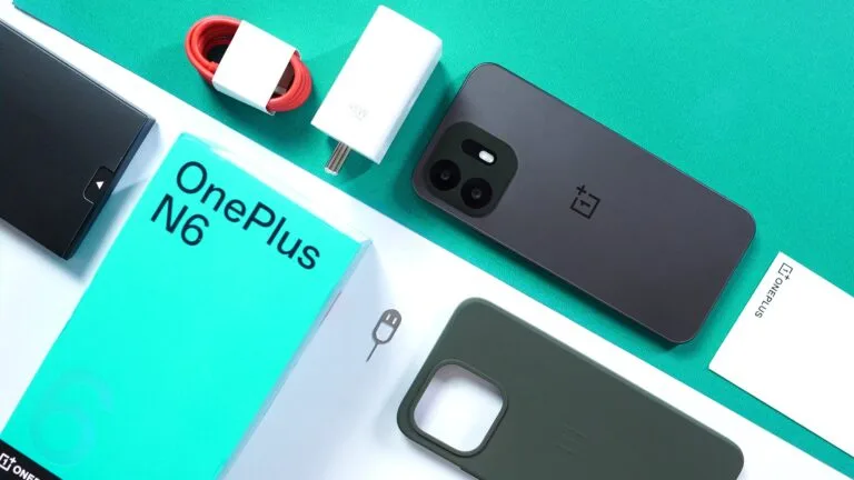 OnePlus N6 Design and Official Specs Revealed: Launch Confirmed for June 30 in India OnePlus N6 in Midnight Green shown with retail packaging, 45W fast charger, red USB‑C cable, silicone case, and documentation