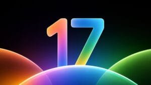 Vibrant, glossy graphic of the number 17 in a rainbow gradient rising over smooth, multicolored curved shapes against a deep black background, representing ColorOS 17.