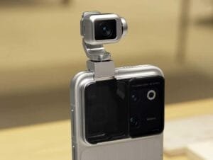 Close-up view of the Honor Robot Phone, featuring its distinctive pop-out, multi-axis robotic gimbal camera module mounted on the back of the device, with a sleek silver finish and rear camera array visible.