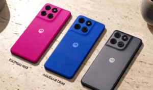 Rear view of the Motorola Moto G77 Power in three color variants: Fuchsia Red, Nautical Blue, and Impenetrable Gray, showing the quad-camera module and centered Motorola logo on a textured matte finish.