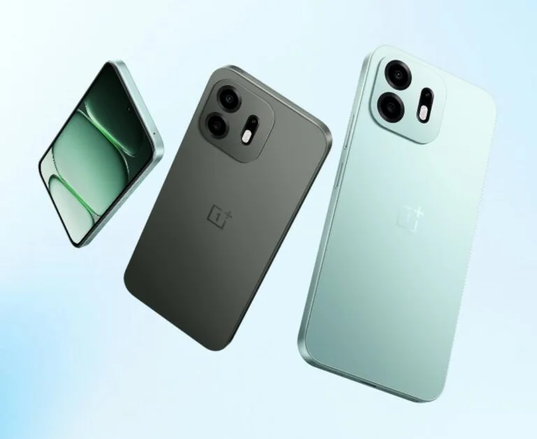 OnePlus N6 Launched in India: Mediatek Dimensity 6360 Apex and 8,000mah battery Three views of the OnePlus N6 smartphone against a soft light blue background: one showing the front display, and two showing the rear design in Dark Gray and Fresh Mint colors. The back features a rectangular camera module with two lenses, an LED flash, and the OnePlus logo centered below.