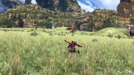 Gameplay screenshot from Xenoblade Chronicles: Definitive Edition - Nintendo Switch 2 Edition. Protagonist Shulk runs through tall grass in the Gaur Plain area, carrying the Monado sword on his back. The background shows rocky cliffs, a small waterfall, grazing wildlife, and a large creature in the distance. On-screen UI includes a minimap, the in-game time 12:35, location label, control prompts, and a story button.