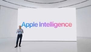 Apple executive presenting Apple Intelligence on large display during product launch event