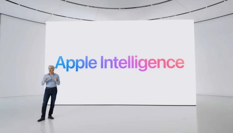 Apple executive presenting Apple Intelligence on large display during product launch event