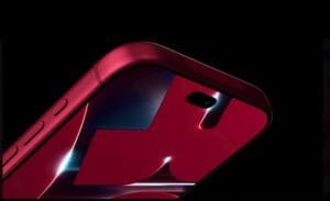 Close-up side view of the Apple iPhone 18 Pro in Dark Cherry finish, showing its glossy red back panel, rear camera cutout, and side buttons against a dark background.