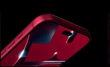 Close-up side view of the Apple iPhone 18 Pro in Dark Cherry finish, showing its glossy red back panel, rear camera cutout, and side buttons against a dark background.