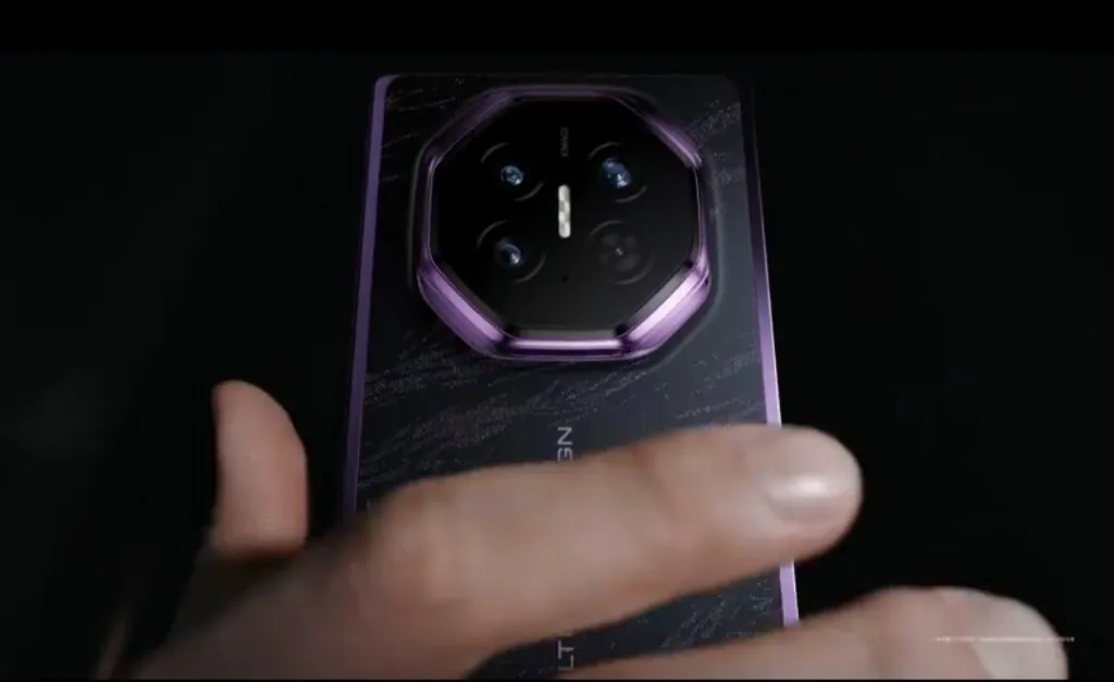 Huawei Teases Mate XT 2 With Three New Color Options Close-up view of Huawei Mate XT2 Extraordinary Edition in Brocade Purple finish, showing octagonal camera module with purple metallic frame, textured black back panel, and hand holding the device.